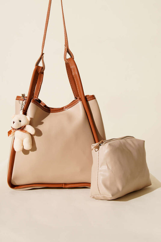 Borsa per il trucco da donna con bottone automatico, beige e marrone chiaro.