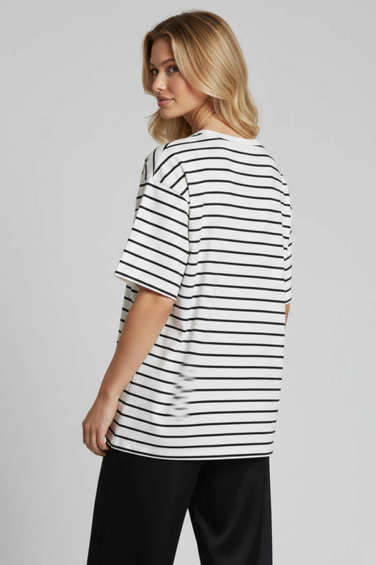 قميص واسع بتفاصيل خطوط بلون عاجي