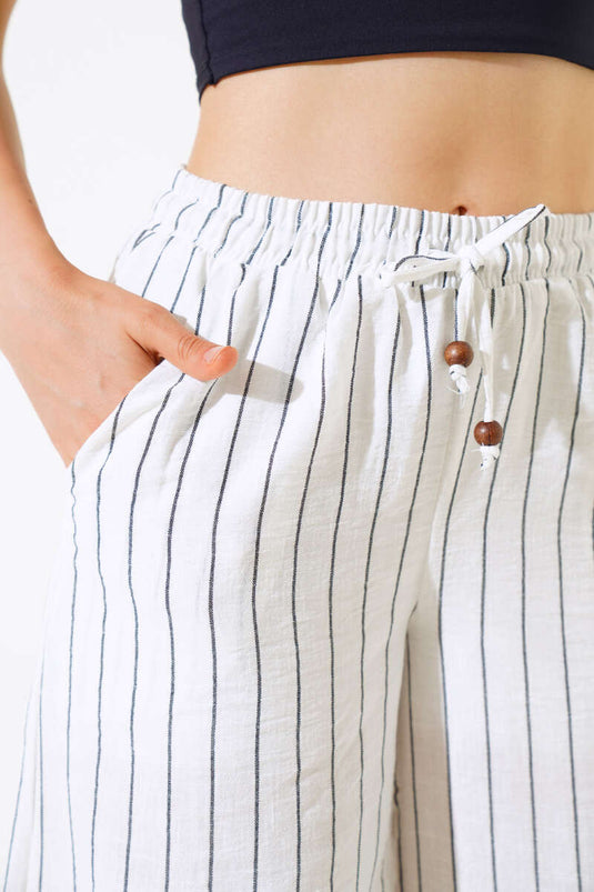 Pantalon rayé en lin blanc à taille élastique