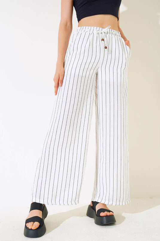 Pantalon rayé en lin blanc à taille élastique