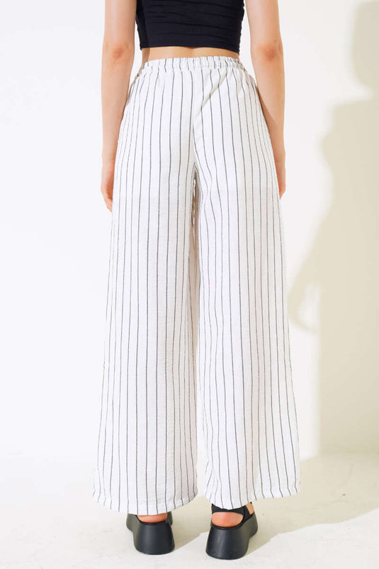 Pantalon rayé en lin blanc à taille élastique
