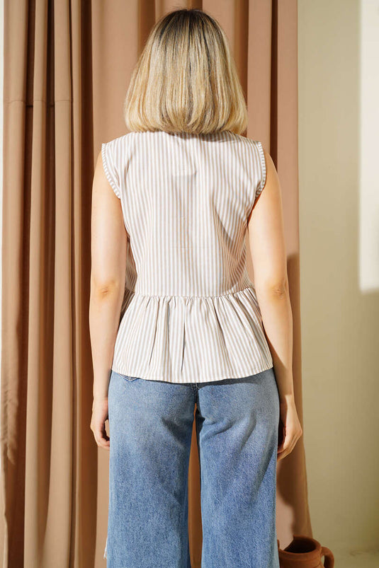 Chemise à rayures beige avec nœud sur le devant