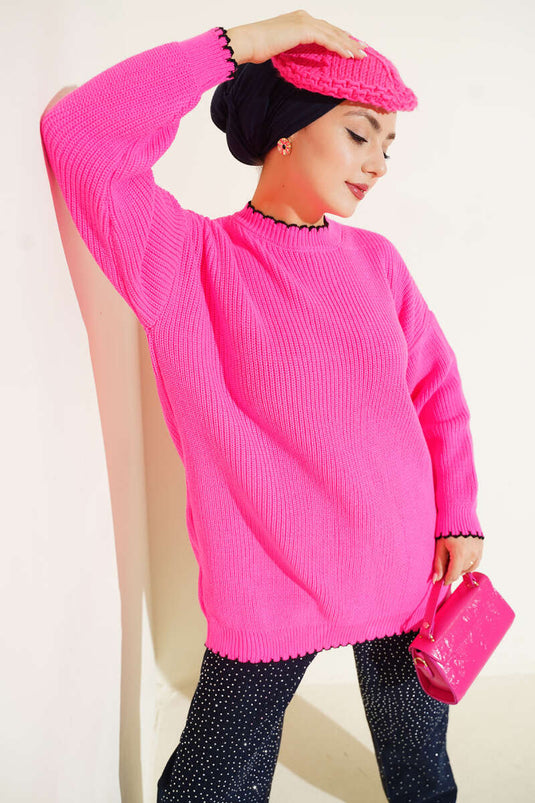 تونيك تريكو بتفاصيل درزة الراعي باللون الوردي