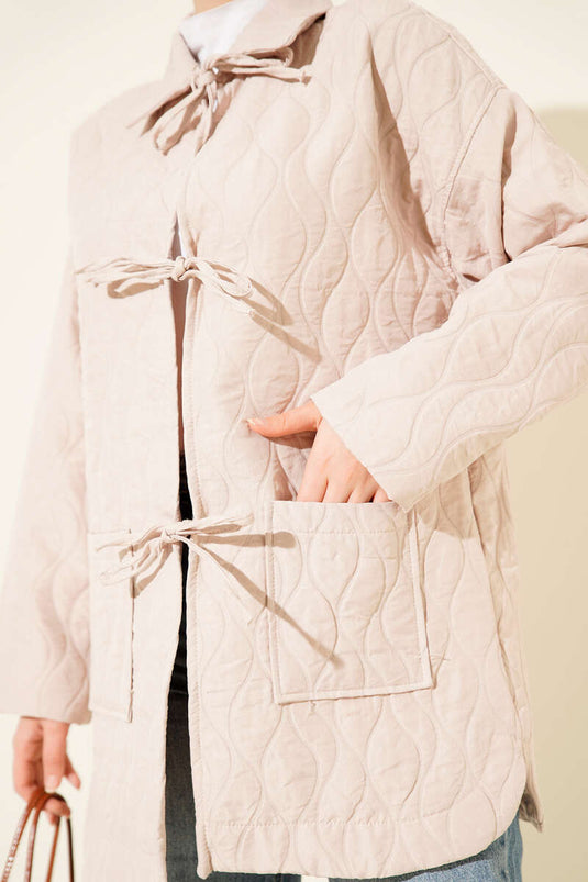 Gewatteerde jas met golfpatroon in beige