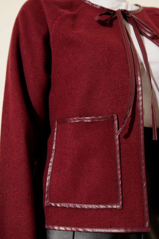 جاكيت قصير من الجلد باللون العنابي