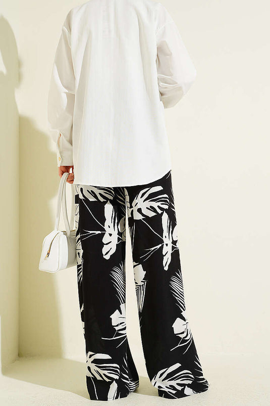 Pantalon à jambes larges élastiqué à motif noir à motifs