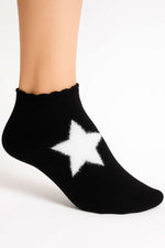 Chaussettes-chaussons en tissu éponge à motifs étoiles