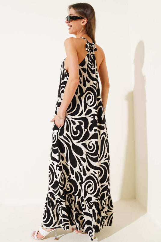 Schwarzes Kleid mit gemusterten Seilträgern