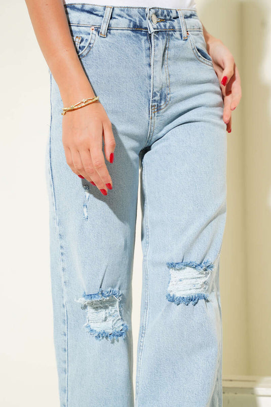 بنطال جينز مفتوح للثلج، بفتحة ليزرية عند الركبة