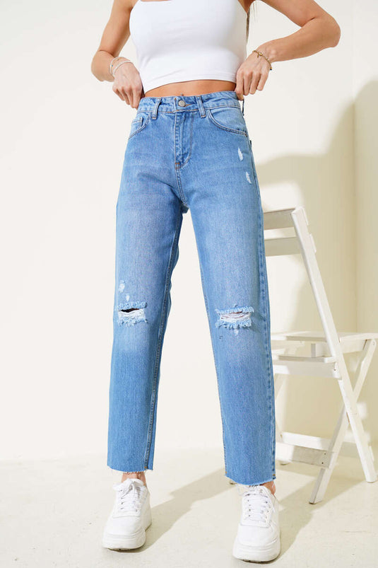 Jean skinny bleu clair déchiré aux genoux