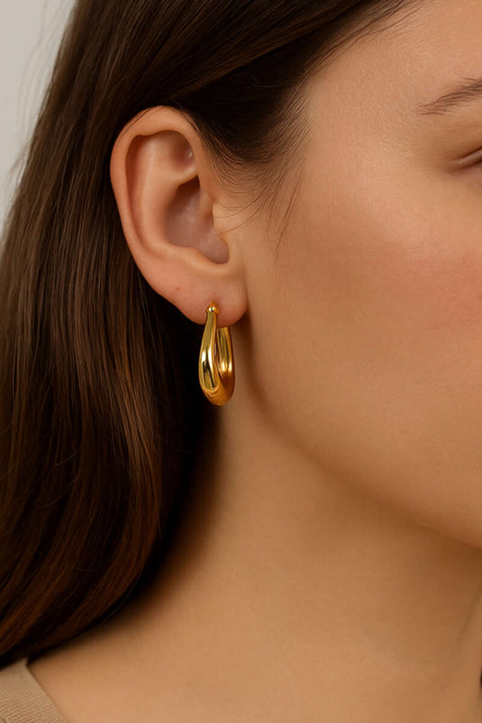 Grote, bolvormige oorringen in goud