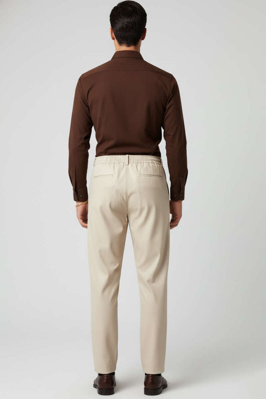 Pantalon ample boutonné beige pour homme