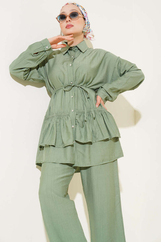 Two-piece set with ruffled skirt and drawstring belt, light green.