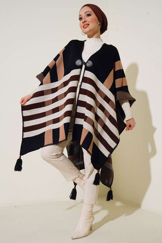 Poncho de punto estampado con detalle de borlas en el bajo Negro Beige