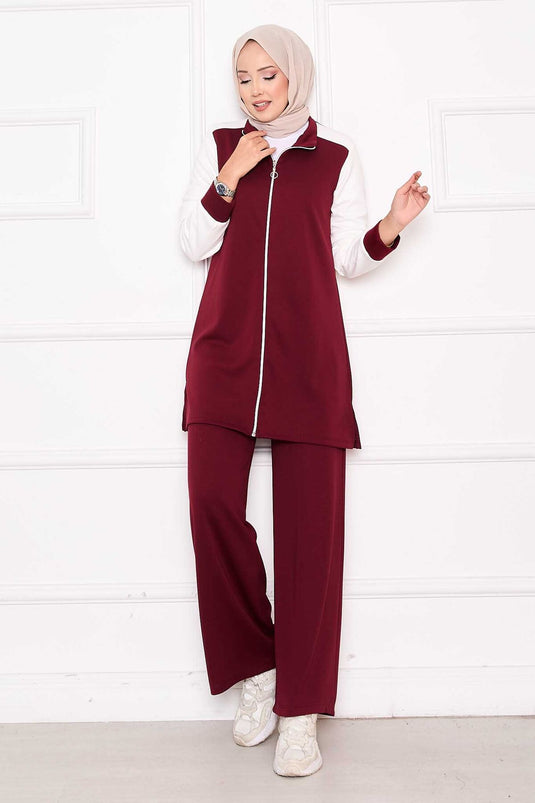 بدلة رياضية مكونة من قطعتين بسحاب ومزينة باللون الأحمر الداكن