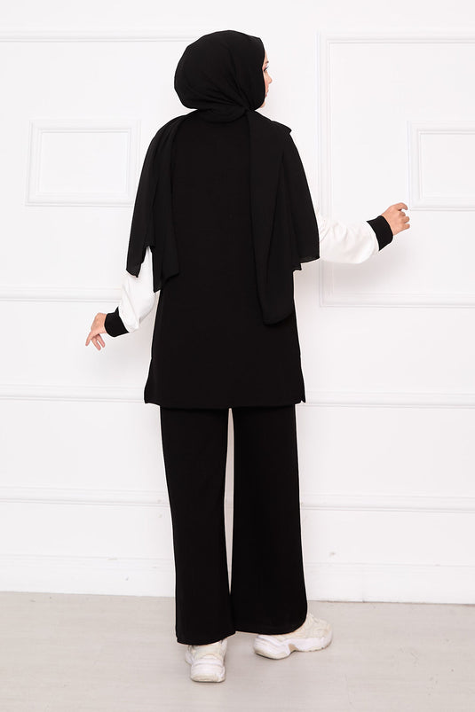 Combinaison de sport deux pièces zippée et garnie noire