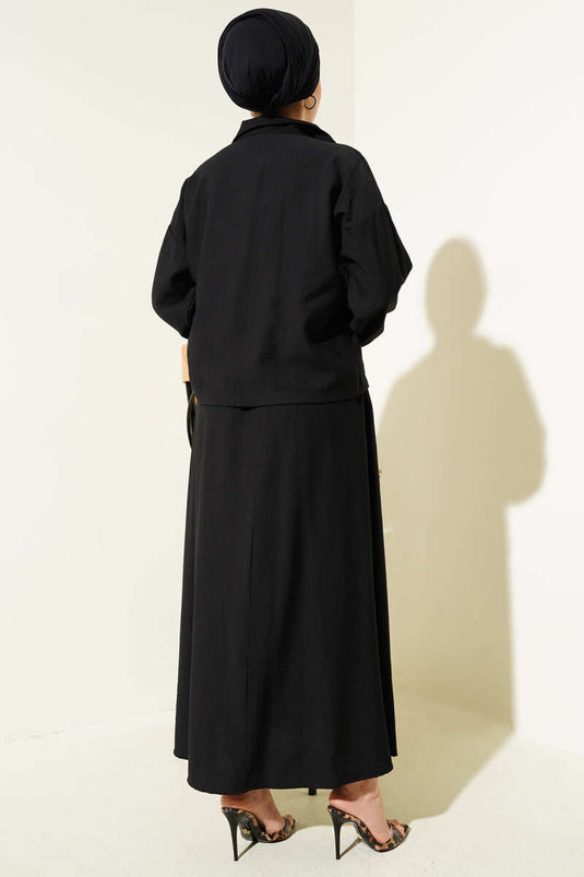 Ensemble deux pièces noir à jupe à rabat et poches zippées