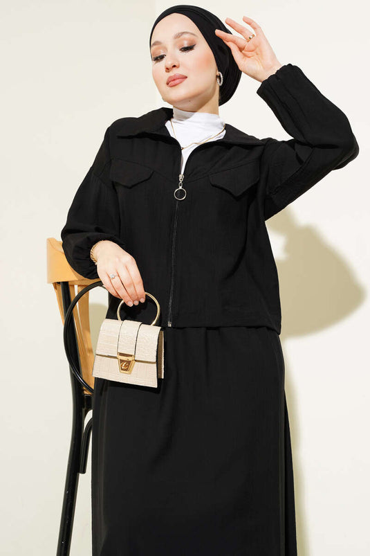 Ensemble deux pièces noir à jupe à rabat et poches zippées