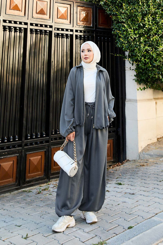 بدلة رمادية فضفاضة من قطعتين بأكمام خفاش وسحاب