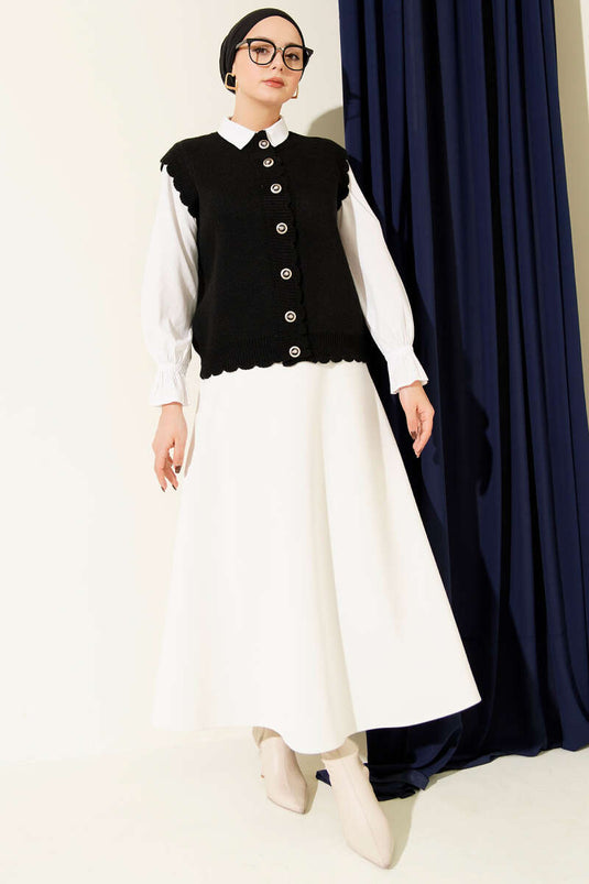 Gilet en maille noir à boutons et détails à volants