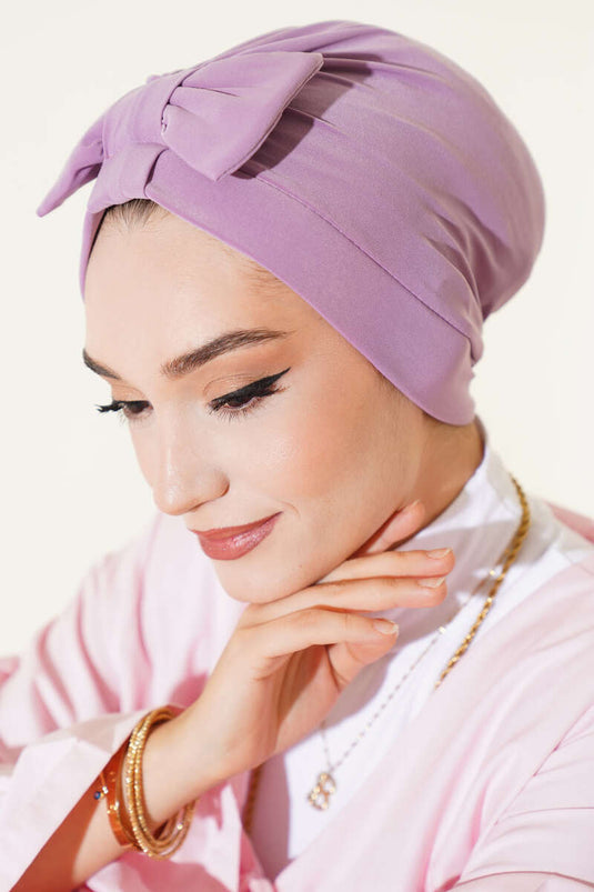 غطاء رأس مزين بفيونكة، لون أرجواني فاتح