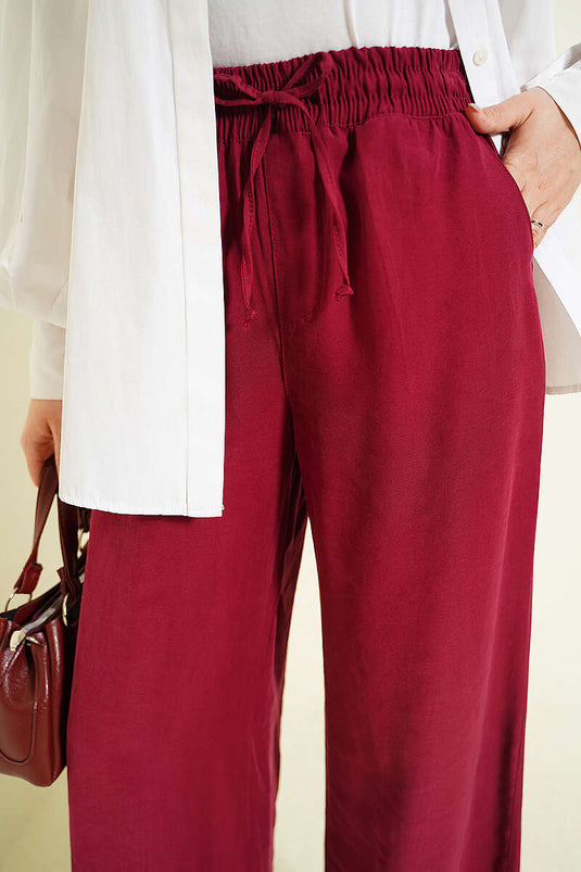 Pantalon Tensel bordeaux à taille élastique et jambes larges