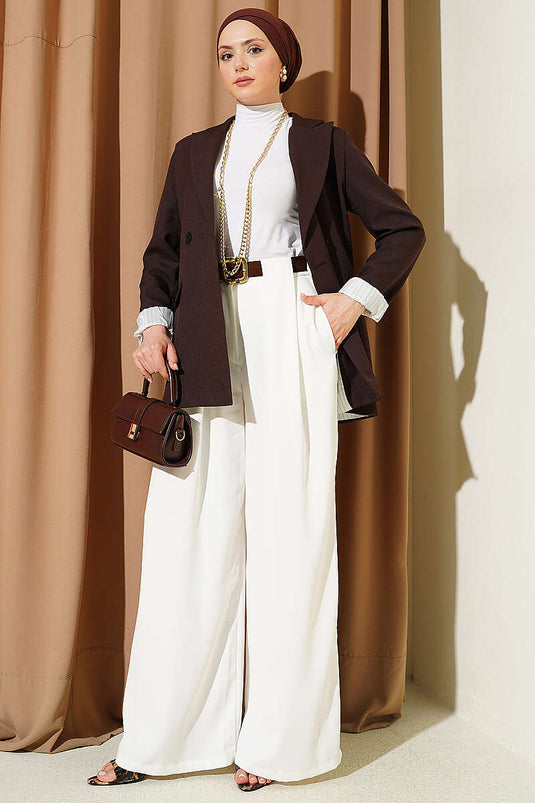 Pantalon en tissu blanc à larges plis détaillés