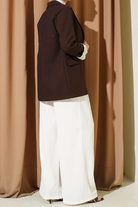 Pantalon en tissu blanc à larges plis détaillés