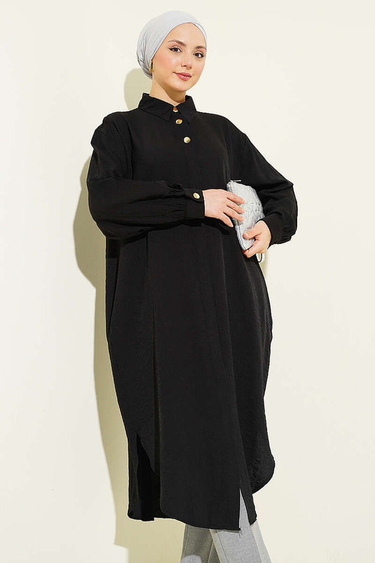 Chemise longue noire avec poches et boutons cachés
