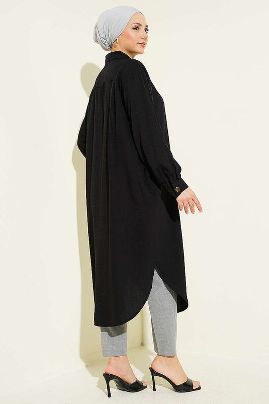 Chemise longue noire avec poches et boutons cachés