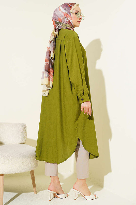 Chemise longue verte avec poches et boutons cachés