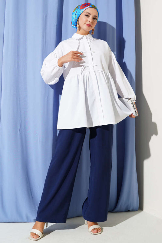 Chemise blanche à boutons cachés et boutons ronds