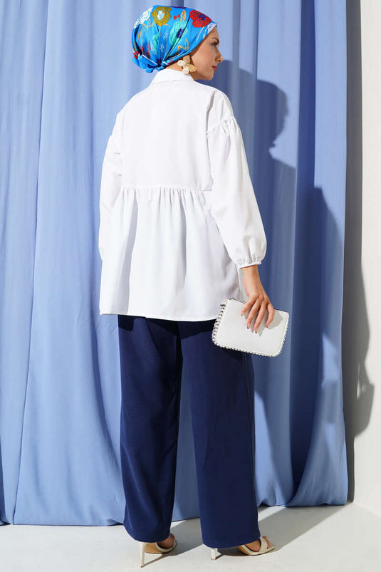 Chemise blanche à boutons cachés et boutons ronds