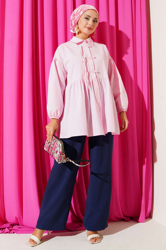 Chemise rose à boutons cachés et boutons boule