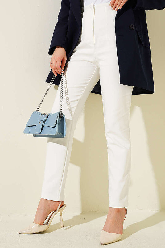 Pantalon blanc à jambe étroite avec fermeture éclair cachée