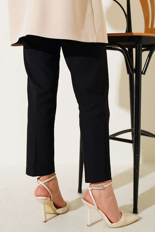 Pantalon noir à jambe étroite avec fermeture éclair cachée