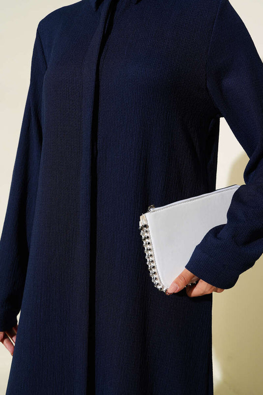 Chemise longue bleu marine à patte de boutonnage cachée