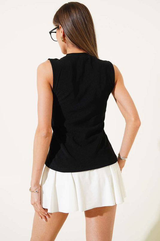 Chemisier côtelé noir à boutons dorés