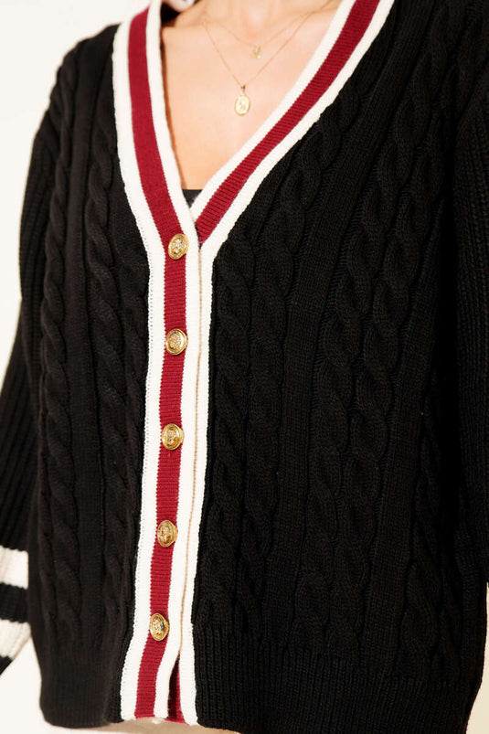 Gilet en maille rayée noire avec boutons dorés