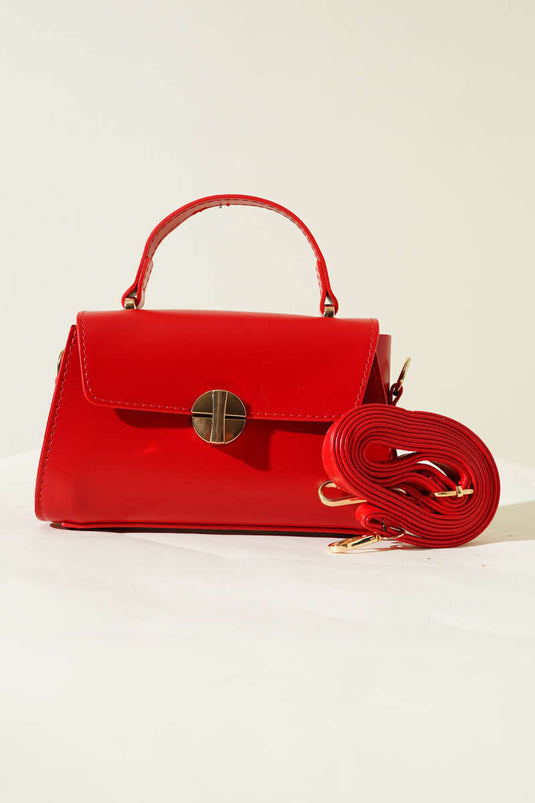 Sac rouge à fermeture éclair dorée