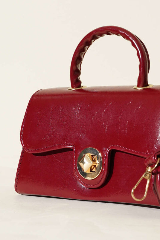 Sac en cuir verni bordeaux avec fermeture dorée Kilitli