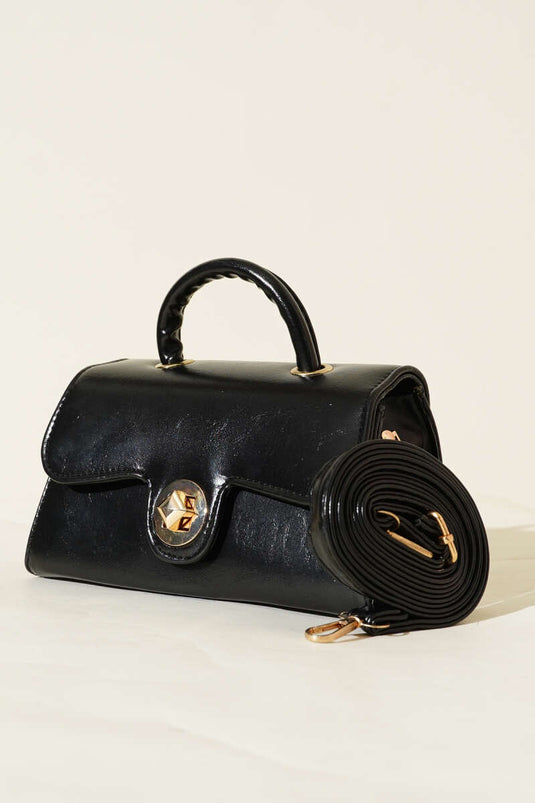 Sac en cuir verni noir avec fermoir doré