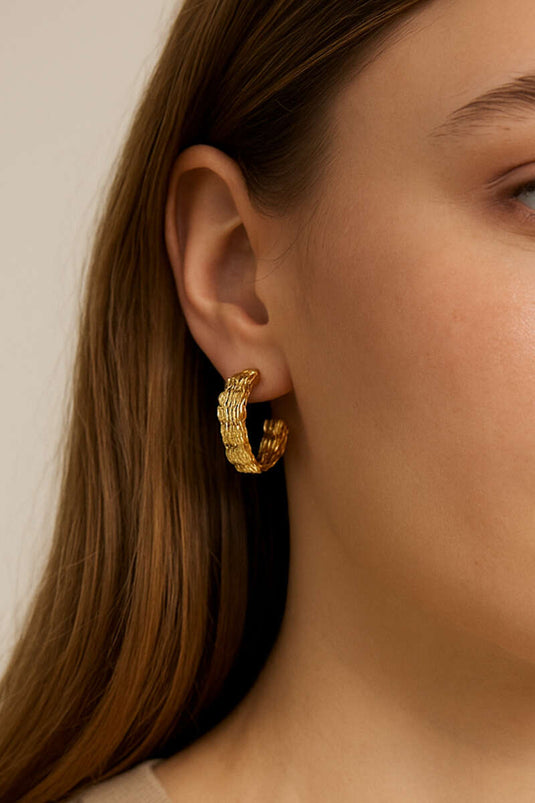 Dikke geweven oorringen in goud