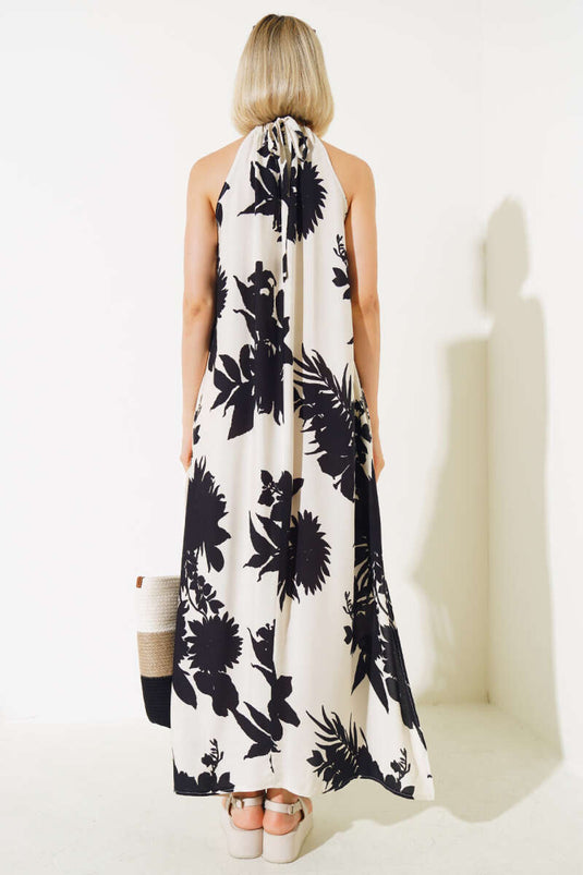 فستان أسود بدون أكمام منقوش بحزام حبلي