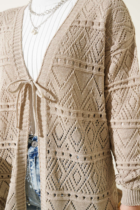 Cardigan tricoté à motifs noués en corde beige