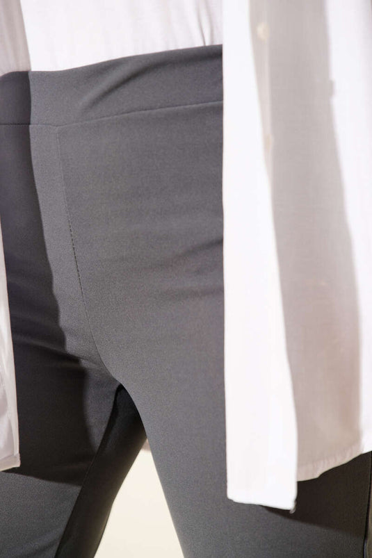 Spanish-style flared double-leg trousers with elasticated waistband, smoke grey.