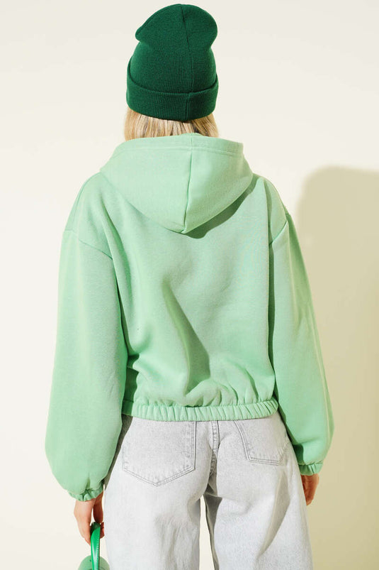 كارديجان قصير من الصوف الأخضر بغطاء للرأس