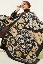 Poncho noir à motifs variés