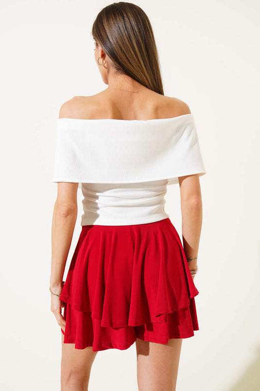 Blouse blanche à col bateau et fermeture éclair