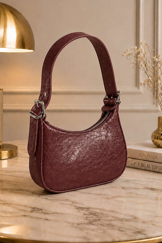 Sac à bandoulière en cuir verni bordeaux